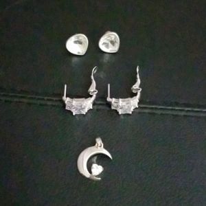 Sterling silver, cubic zirconia earrings/pendant.
